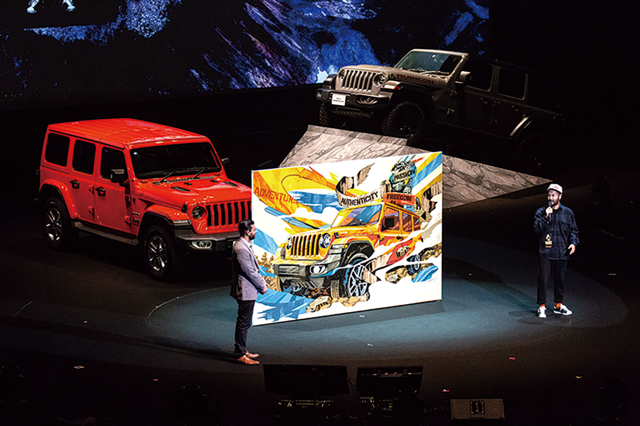 海外で活動するライブペインター、DRAGON76氏のトークショーも開催。氏が描いた、道なき道を進むラングラーは、JLとの新たな冒険旅を予感させてくれた。